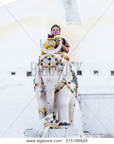 Keepers of the stairs statue in front of Boudhanath stupa, Nepal