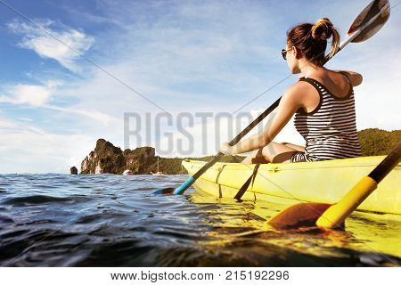 Kayaking or kanoeing concept at tropical sea beach