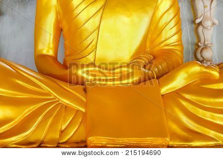 Golden Buddha statue meditation in measure Thailand.