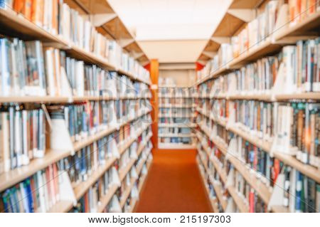 blurred background of books in library. shelves with books in the library