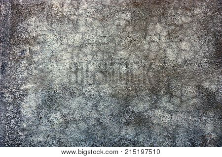 gray dark background from a fragment of a concrete wall of a building