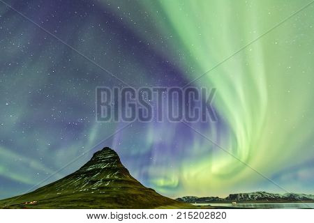 Northern Light Aurora Borealis At Kirkjufell Iceland With Fully Start In The Sky