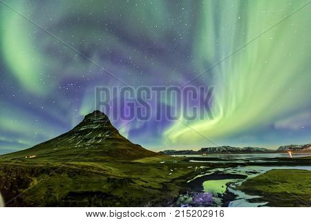 Northern Light Aurora Borealis At Kirkjufell Iceland With Fully Start In The Sky