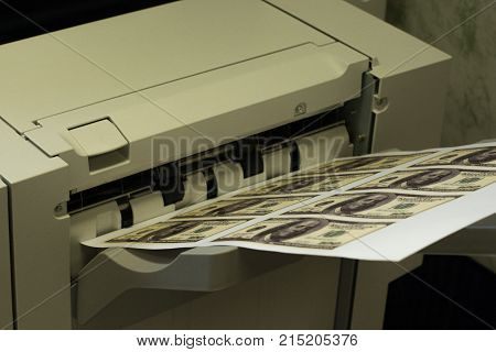 Printer printing fake dollar bills isolated on white