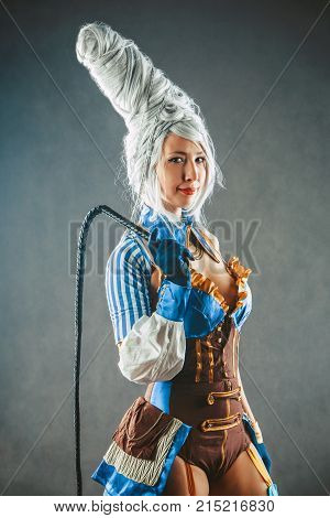 Beautiful Woman Trainer With The Whip In A Sexy Circus Suit
