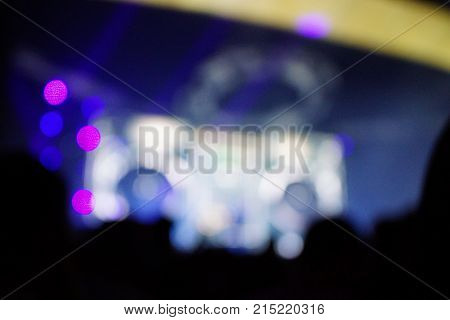 Texture Blur Scene Multicolored Lights And Smoke In Concert With Silhouettes Of Peoplebackground For