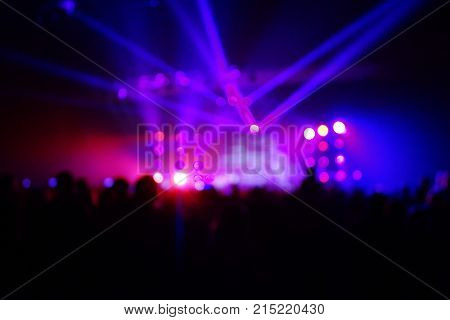 Texture Blur Scene Multicolored Lights And Smoke In Concert With Silhouettes Of Peoplebackground For