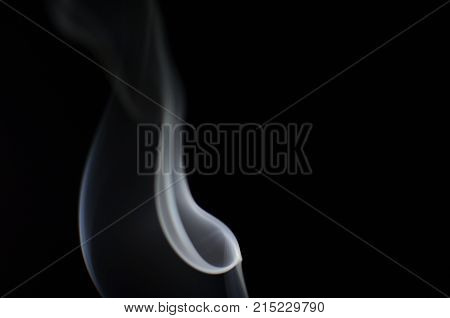 Light shine to smoke on black background