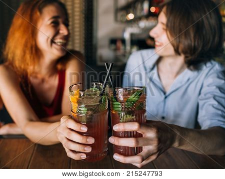 friends have drinks in a bar. boy in a friendzone. friendship fun recreation joy concept.
