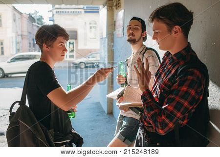 Geek boy resist bad influence. teenage smoking addiction bad habits concept. Modern urban youth lifestyle