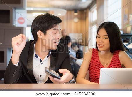bisuness people discussing with notebook or laptop in office.
