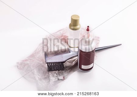Close-up Of Chemical Hair Color Dye Set With Comb Brush