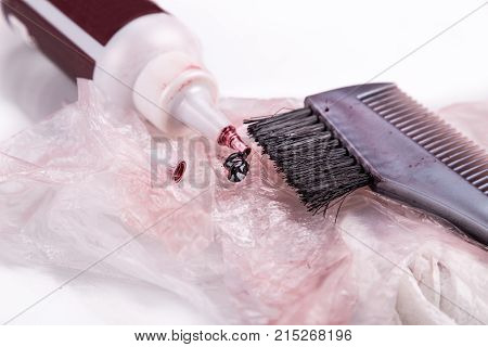 Close-up Of Chemical Hair Color Dye Set With Comb Brush