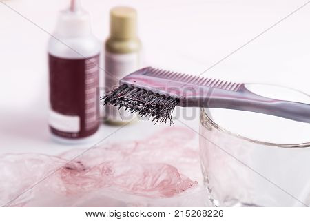 Close-up Of Chemical Hair Color Dye Set With Comb Brush