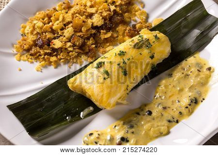 Fried Fish With Farofa And Passion Fruit Sauce - Traditional Amazonian Dish - Filhote Caboclo