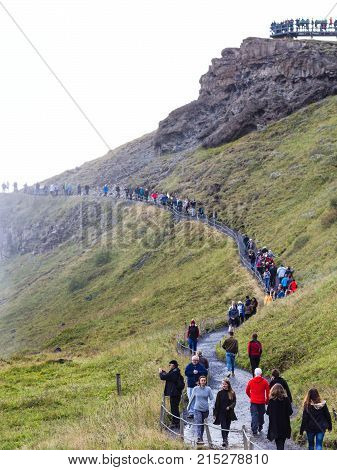 Tourists On Path To Gullfoss Waterfall Viewpoint