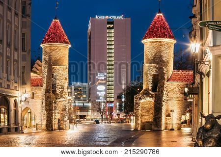 Tallinn, Estonia - December 5, 2016: Famous Landmark Viru Gate In Street Lighting At Evening Or Night Illumination. Sokos Hotel Viru Owned By Intourist And Called Viru Hotell