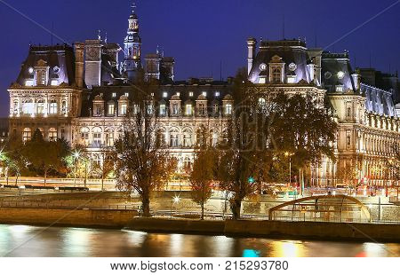 City Hall in Paris at night - building housing City of Paris administration. Building was constructed between 1874 -1882, architects Theodore Ballou and Edouard Deperta. France