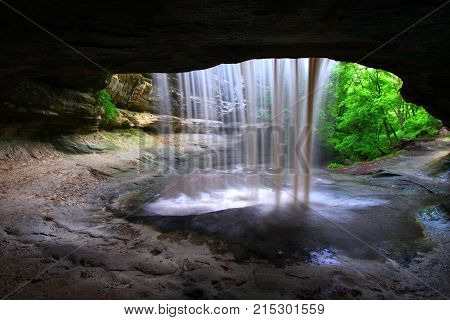 Rock overhang frames Lasalle Falls of Starved Rock State Park in central Illinois