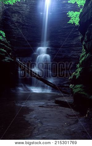Sunlight illuminates the brink of Lake Falls at Matthiessen State Park in central Illinois
