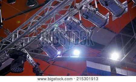 Spotlight. Many spotlights that illuminate the stage at a concert. Stage Spotlight with Laser rays at event conference hall 