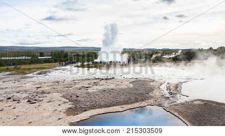 Strokkur Geyser Eruption And Pool Of Geysir