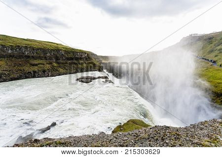Stream Of Waterfall And Water Spray Over Canyon