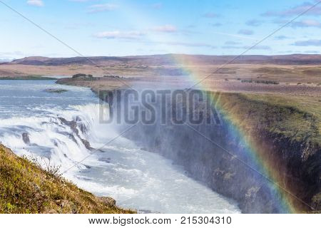 Rainbow Over Gullfoss Waterfall In Canyon
