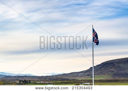 Icelandic Flag And Landscape In Iceland