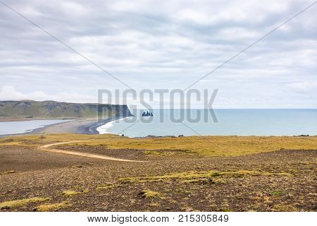 Dyrholaey Promontory And Volcanic Beach In Iceland
