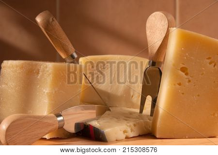parmigiano, traditional italian cheese platter, with fork and kinfe