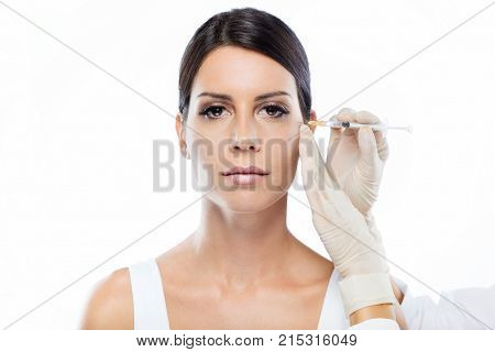 Beautiful Young Woman Getting Botox Cosmetic Injection In Her Face.