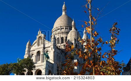 The basilica Sacre Coeur is a Roman catholic church located at the summet of the butte Montmartre , the highest point in Paris.