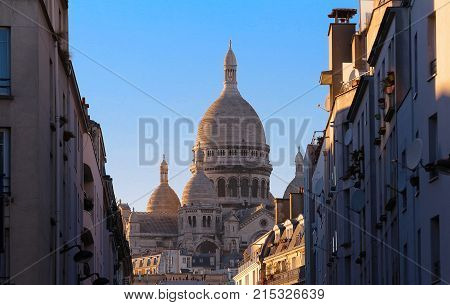 The basilica Sacre Coeur is a Roman catholic church located at the summet of the butte Montmartre , the highest point in Paris.