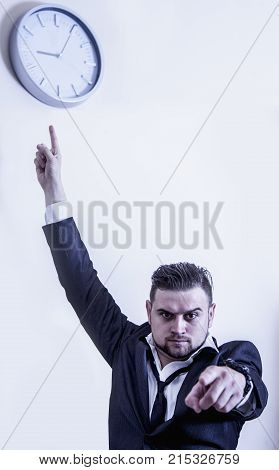 You're Late! Angry Businessman Is Pointing At  Clock Suggesting You Are Late For Work. (work, Respon