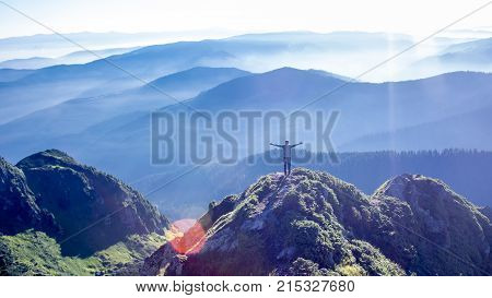 Man on the top of the mountain range of Carpathians mountains