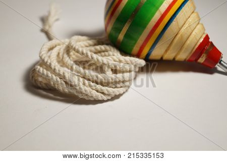 Mexican wooden toy (trompo) with its rope