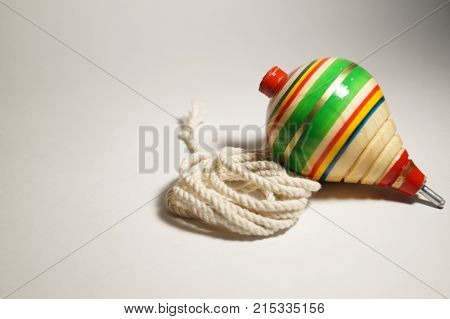 Mexican wooden toy (trompo) with its rope