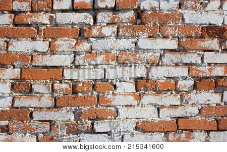 Old red with hollows a brick wall of the house a structure