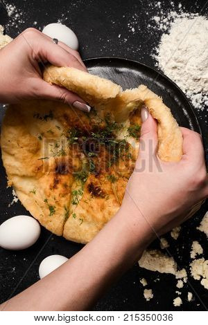 nourishing imeretian khachapuri tasting. fatty delicious unhealthy food. georgian cuisine