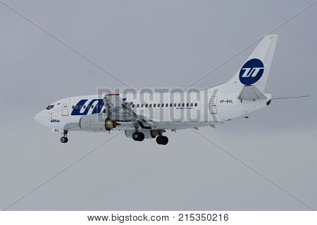 ST. PETERSBURG, RUSSIA - FEBRUARY 25, 2017: The Boeing 737-500 (VP-BVL) of UTair airline on a glide path in the cloudy afternoon