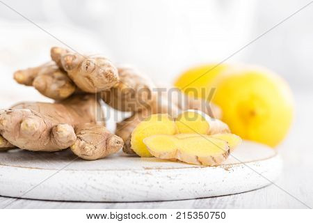 Ginger and lemons on white background cloeup