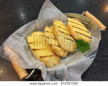 Hot garlic bread ready to serve on the table