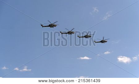Combat Helicopters Mi-28 Fly In Blue Sky