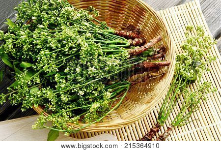 Azadirachta indica flower in basket on wooden background