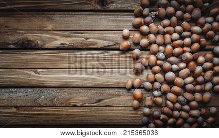 Hazelnut on a wooden background. Useful autumn food. Snacks.