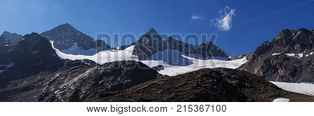 Mountains and peaks landscape. Stubaier Gletscher covered with glaciers and snow natural environment. Hiking in the Stubai Alps. Ski resort in Tirol Austria Europe