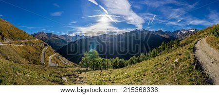 Timmelsjoch High Alpine Road landscape panorama. Mountains and peaks covered with glaciers and snow natural environment. Hiking in the Passo del Rombo. Ötztal alps Austria and Italy border Europe