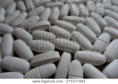 Numerous Oblong White Tablets Of Calcium Citrate