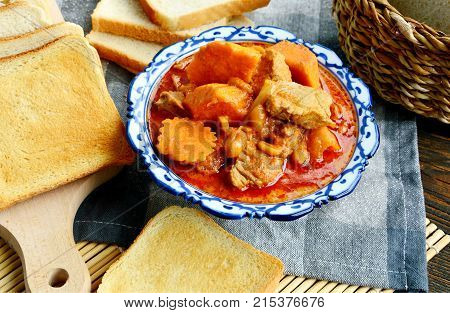 close up from Massaman Curry with toast  (Thai name is Gaeng Massaman).